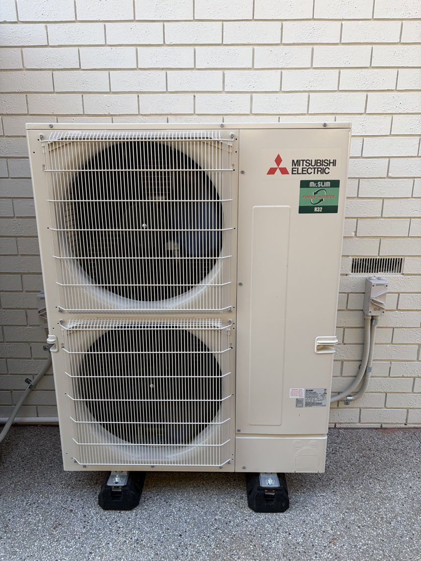 Mitsubishi Electric air conditioning installation with neatly finished pipework