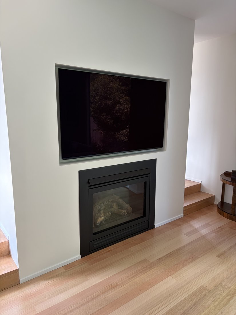 Built-in wood fireplace with a clean architectural finish