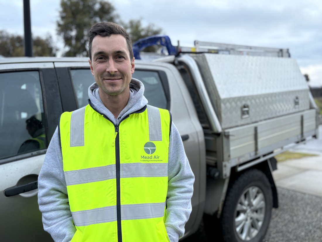 James Mead, owner of Mead Air, beside his work ute